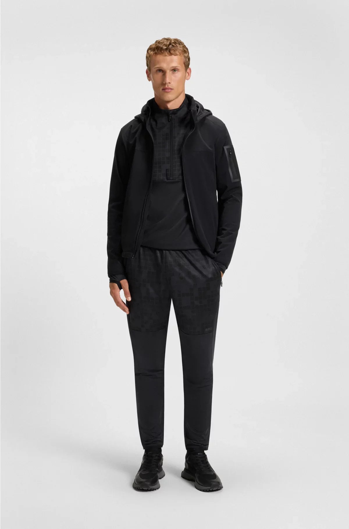 ACTIVE TRACKSUIT BOTTOMS IN GRAPHIC-PRINT PERFORMANCE FABRIC