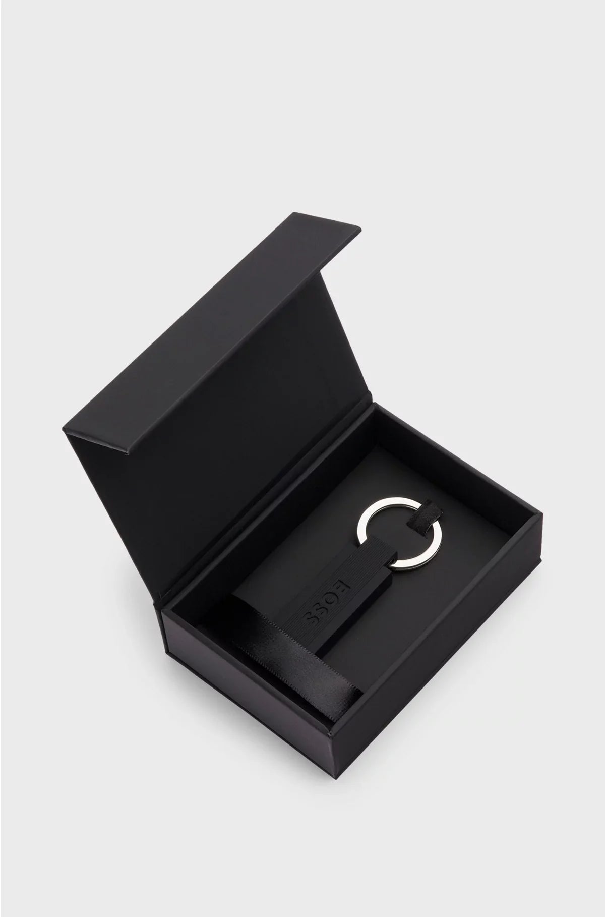 LOGO KEY RING IN BLACK SILICONE AND BRASS